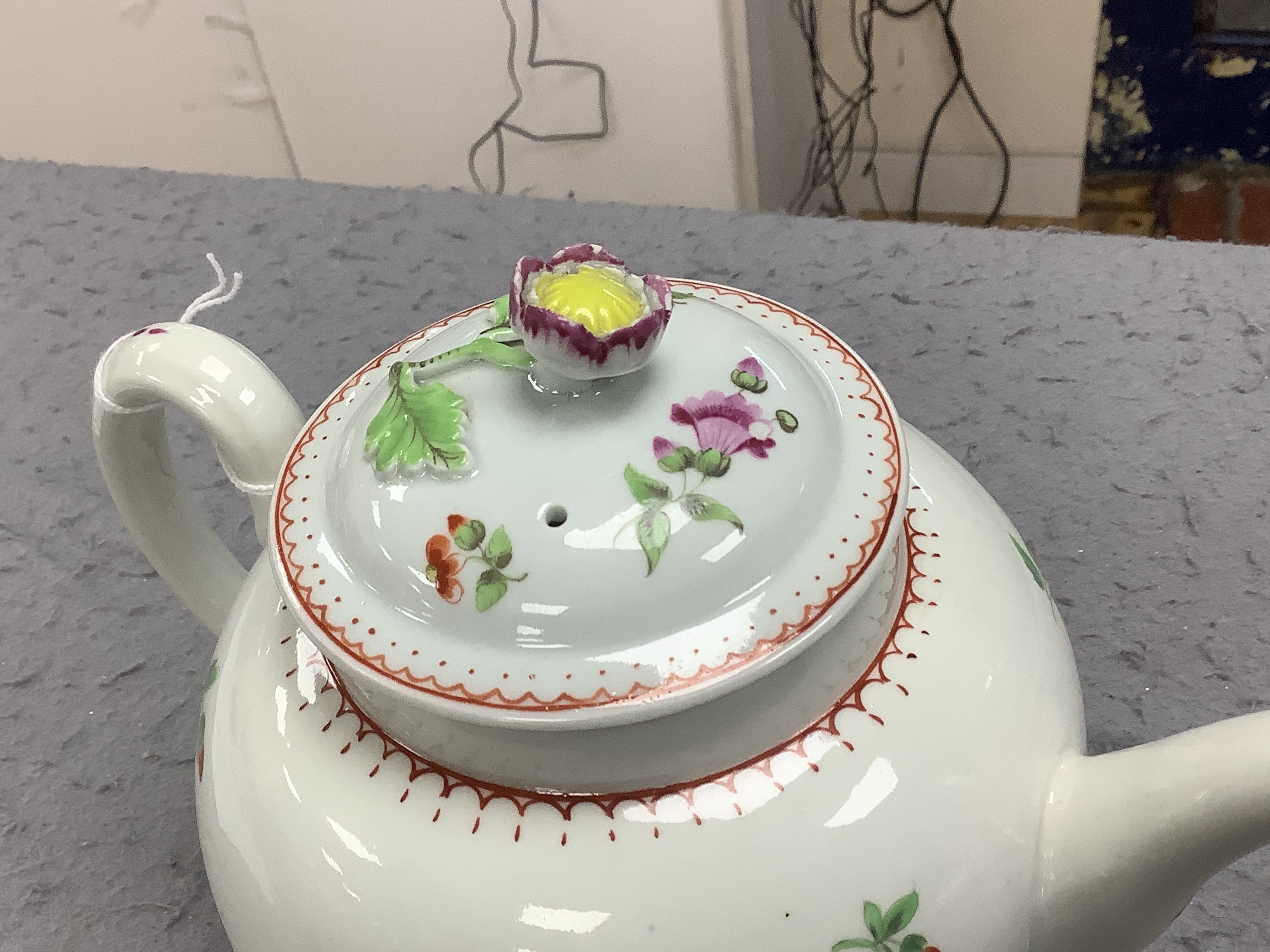 A Worcester globular teapot c. 1780, hand painted with flowers, 21cm wide